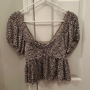 Urban Outfitters adorable cheetah print top. so flattering!! size small.